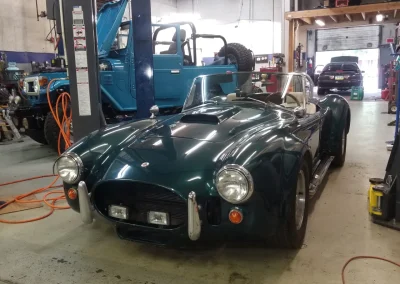 Classic Green Sports Car in the shop 1 Classic Green Sports Car in the shop 1