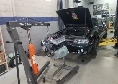 Engine on crane going into car