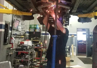 exhaust work car on lift bkg